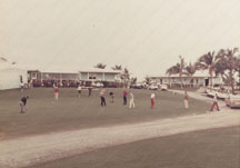 Teeing off in front of Dolphin Clubhouse, formerly Baker residence